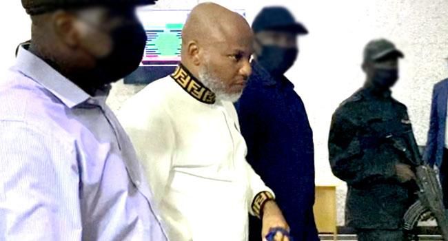 A file photo of Nnamdi Kanu (second left) at the court in Abuja. (Kola Sulaimon/AFP).