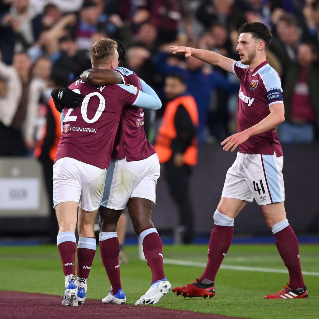 Jarrod Bowen (L) celebrates with teammates Antonio and Declan Rice.