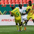 Senegal forward Sadio Mane (C) attempts to burst between Zimbabwe duo Gerald Takwara (L) and Kevin Madzongwe (R) during an Africa Cup of Nations Group B match in Bafoussam on Monday.