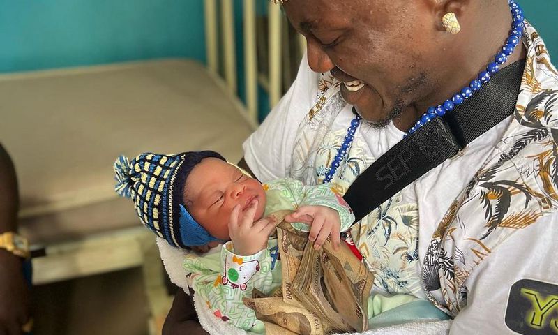 Nigerian singer Habeeb Okikiola, popularly known as Portable and his baby [Instagram/PortableDrZeh]