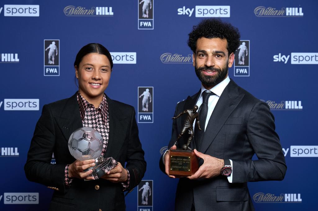 Chelsea women's striker Sam Kerr poses with Liverpool forward Mohamed Salah after both won the FWA Player of the year awards this season