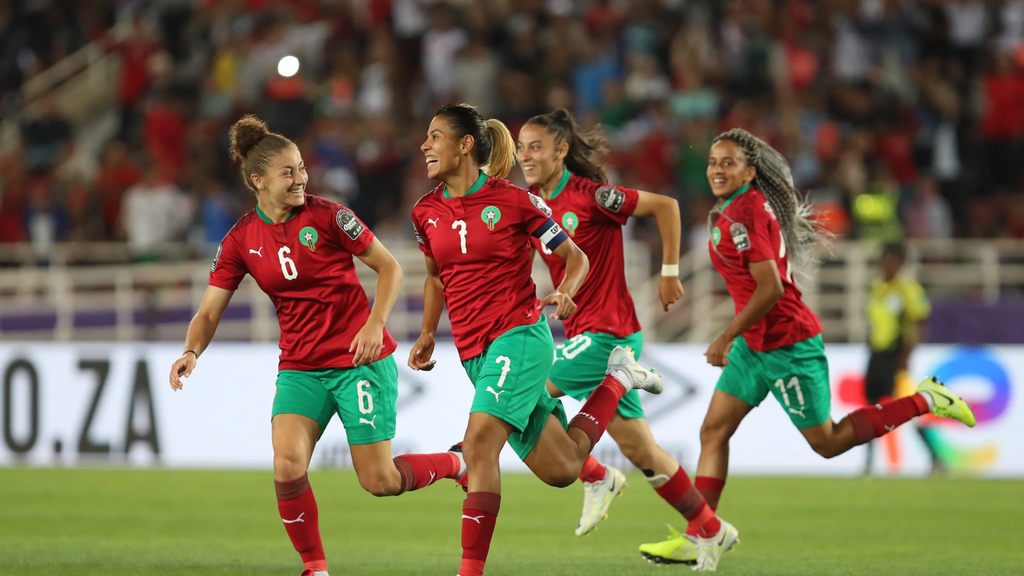 Morocco's captain Ghizlane Chebbak celebrates with her teammates after scoring a free-kick