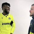 Francis Uzoho (L) share a moment with Manchester United goalkeeper David de Gea (R)