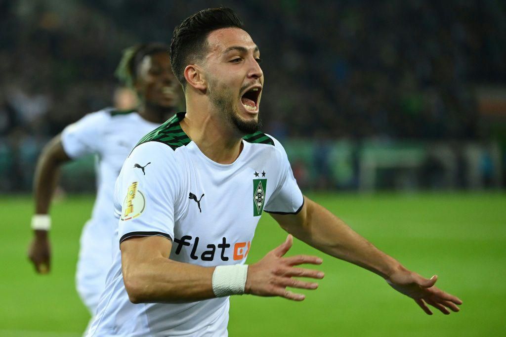 Moenchengladbach's Algerian defender Ramy Bensebaini celebrates his goals against Bayern Munich
