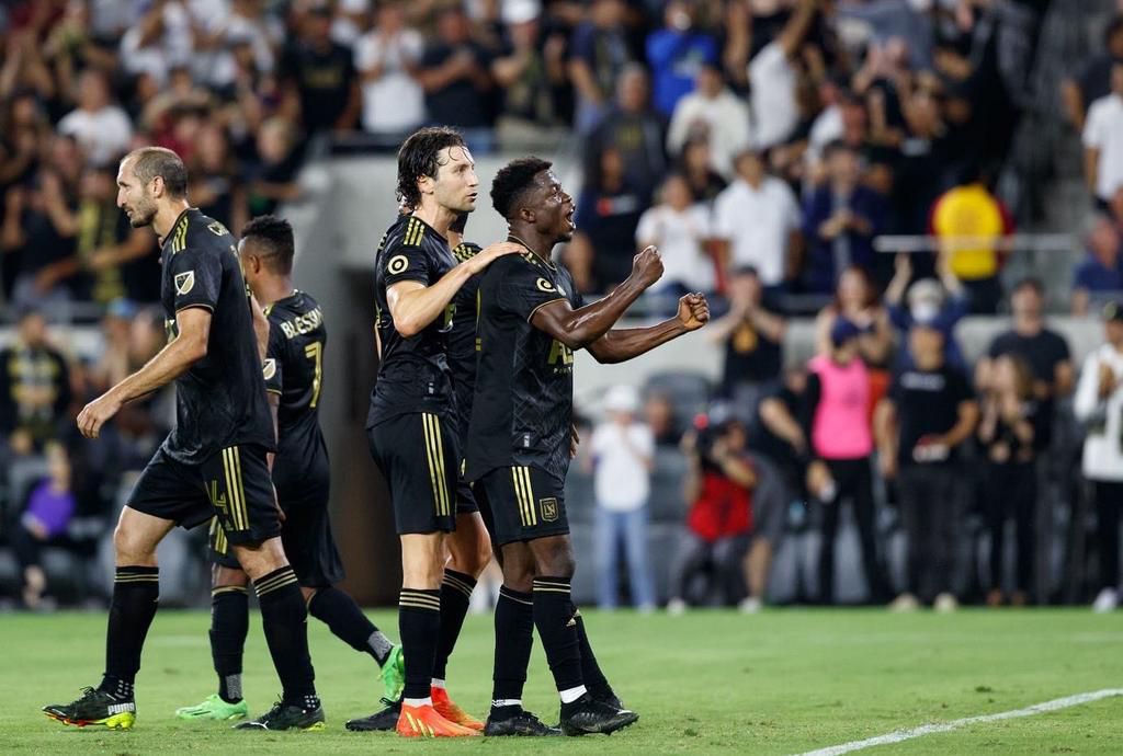 Giorgio Chiellini walks away after celebrating with Opoku.