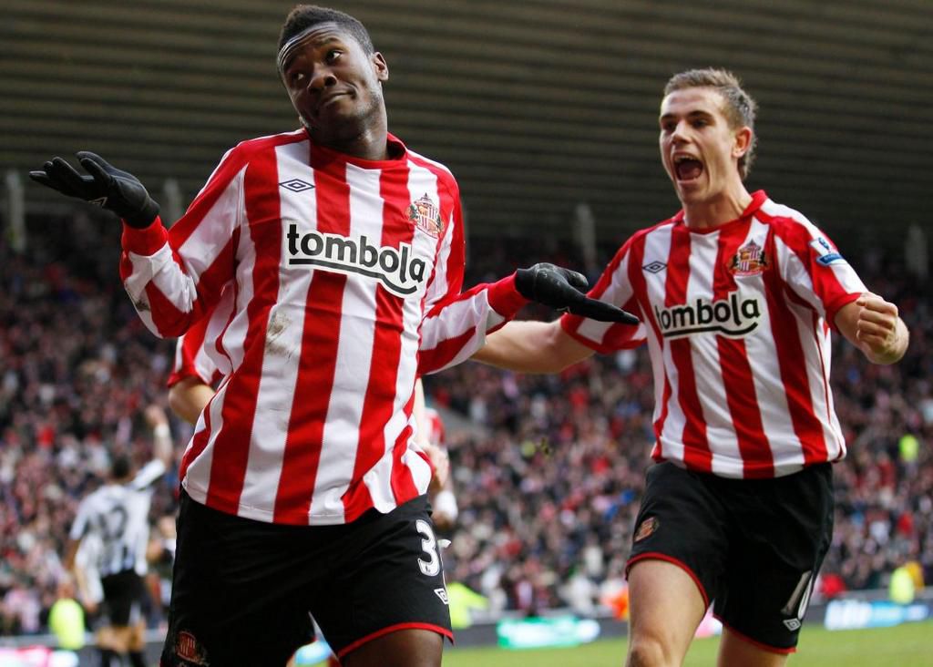 Asamoah Gyan and Jordan Henderson