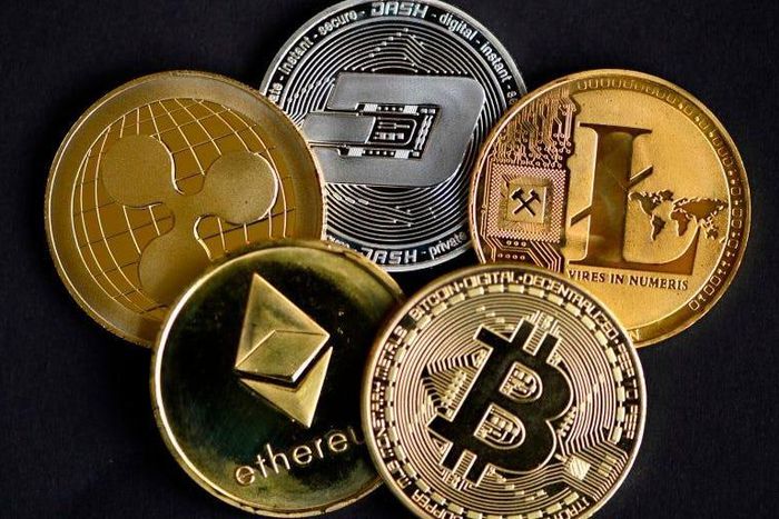 The photo shows physical imitations of cryptocurrency. INA FASSBENDER/AFP via Getty Images