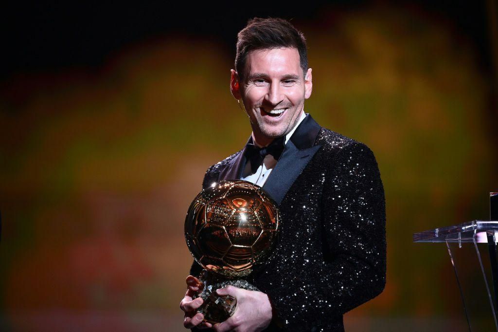 Lionel Messi poses with his seventh Ballon d'Or trophy
