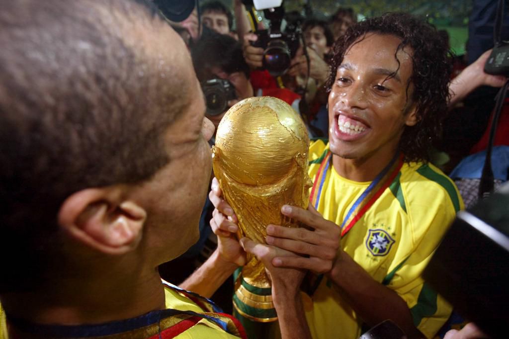 Ronaldinho and Rivaldo celebrating their World Cup win in 2002