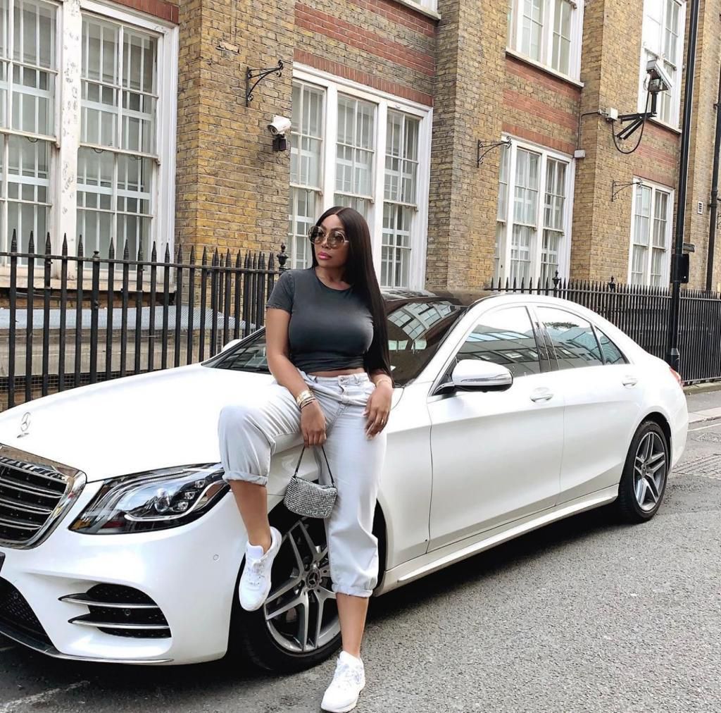 Kika Goodhair and one of her exotic cars