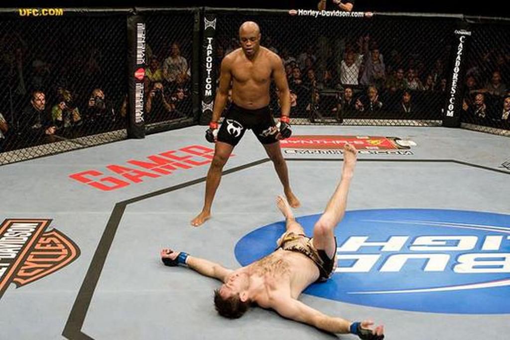 Anderson Silva stands above an unconscious Forrest Griffin