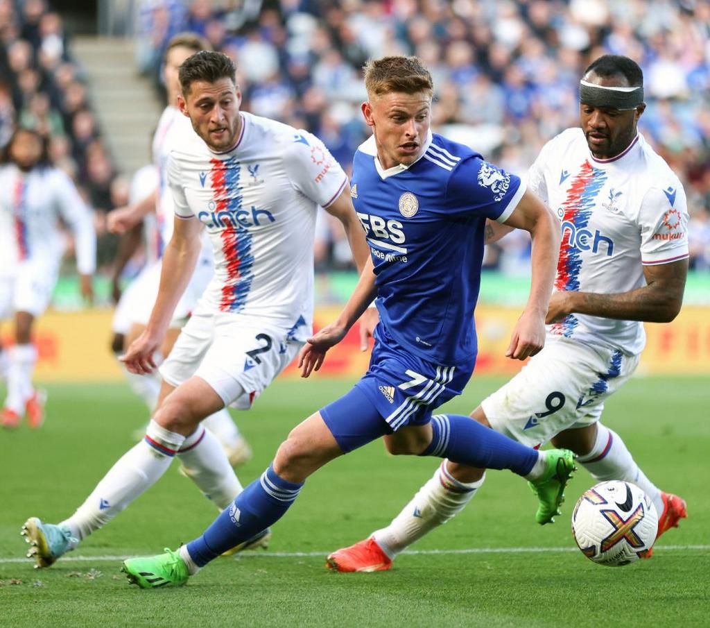 Jordan Ayew marks Harvey Barnes of Leicester City.