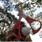 Left: Thomas Figueroa; right: A man holding a giant pair of scissors in Brazil.