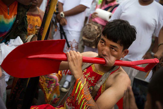 Piercing cheeks with sharp objects during street procession. [X/@utdcounsellor]