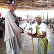 The Zonal Director presenting a cash gift to a corps member. [NAN]