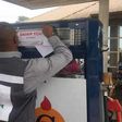 An official of the Department of Petroleum Resources (DPR) sealing off a filling station for violation of due process. [concisenews]