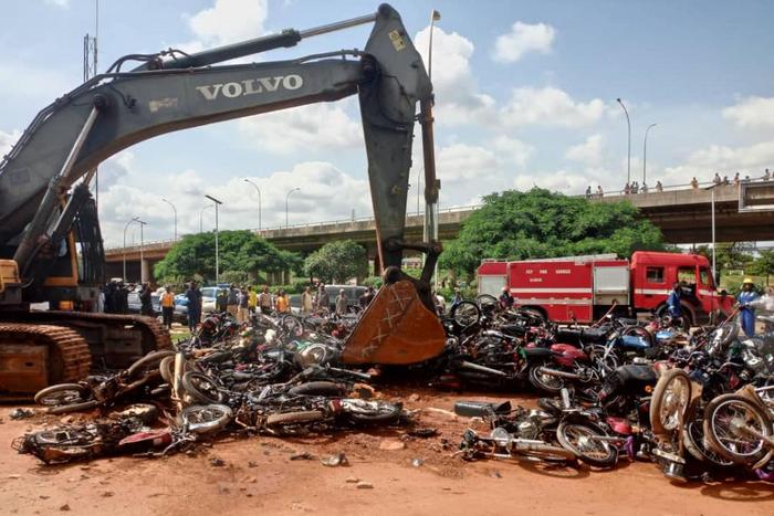 Some of the motorcycles being crushed at Area 1 in Abuja on Thursday. [NAN]