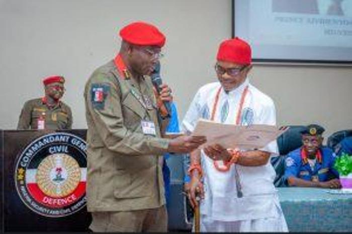 NSCDC Commandant General, Dr Ahmed Audi issuing operational license to a Private Guard Company.