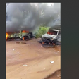 The vehicles of the security operatives after the assailants set them on fire. [Punch]