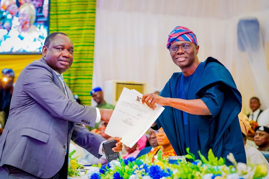 Newly Sworn-in Lagos State Commissioner for Information and Strategy, Mr Gbenga Omotosho and Gov. Babajide Sanwo-Olu of Lagos State, during the Swearing-in of 37 Commissioners and Special Advisers at Ikeja, on Wednesday.