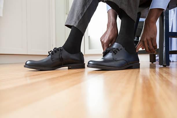 A man putting on shoes