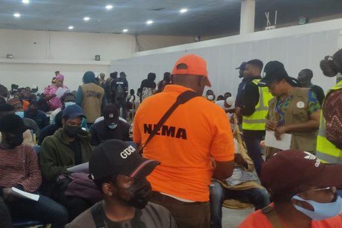 Some of the returnees at the Nnamdi Azikiwe International Airport, on Saturday in Abuja. [Twitter:NiDCOM]