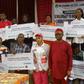 Group photograph with beneficiaries of the scholarship scheme of Dr Chioma Awuzie Foundation (DCAF) in Anambra. [NAN]