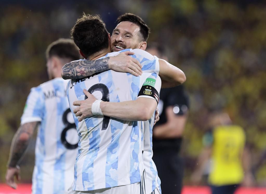 Julian Alvarez celebrating with Lionel Messi after scoring for Argentina at the World Cup