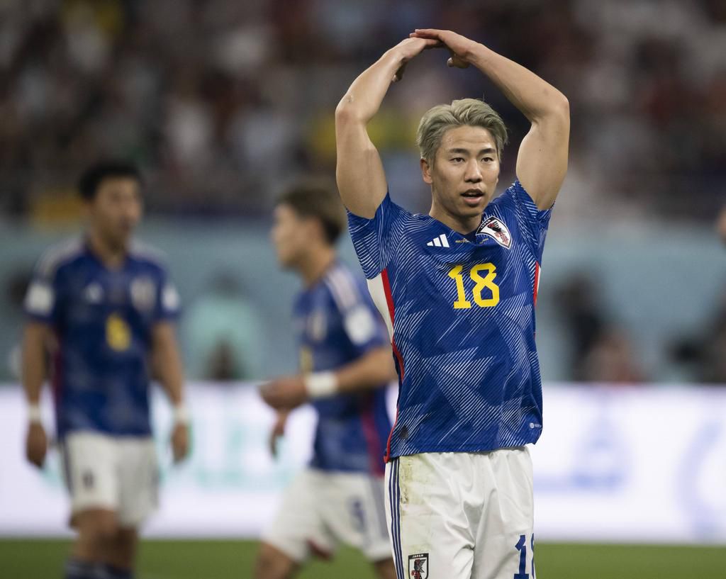 Japan celebrates their win.