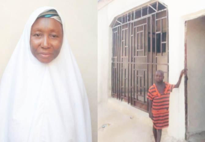 Hajiya Aisha in front of her house. [Daily Trust]