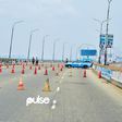 Lagos State Traffic Management Authority (LASTMA) officers place cones on the Third Mainland Bridge (Pulse)