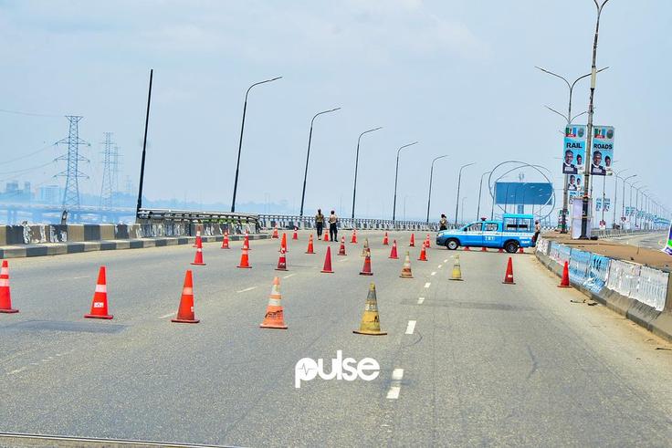 Lagos State Traffic Management Authority (LASTMA) officers place cones on the Third Mainland Bridge (Pulse)