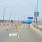 Lagos State Traffic Management Authority (LASTMA) officers place cones on the Third Mainland Bridge (Pulse)