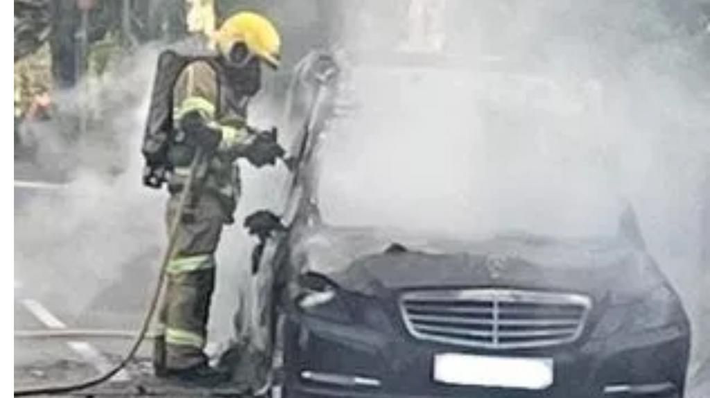 Mercedes-Benz hearse carrying coffin to funeral catches fire