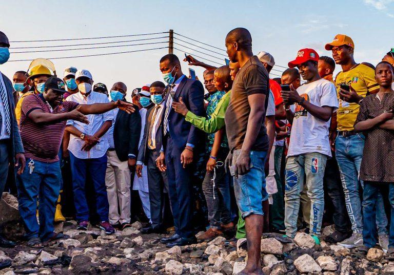 L-R: Chairman of Akere Spare Part Market, Mr Eze narrating a scenario to Lagos State Governor, Mr Babajide Sanwo-Olu during the governor’s visit to the scene of fire incident at Akere Spare Parts Market, Kirikiri road, Olodi Apapa, Ajegunle on Wednesda...