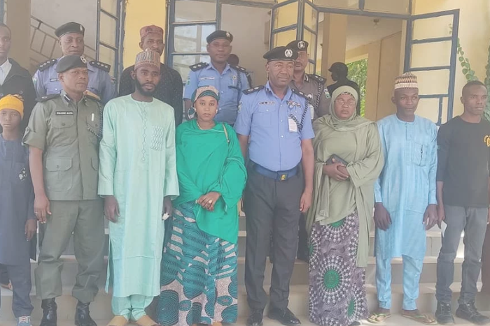 Officers of the Nigeria Police Force and family members of deceased officers after the presentation of cheques to the families [NAN]