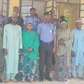 Officers of the Nigeria Police Force and family members of deceased officers after the presentation of cheques to the families [NAN]