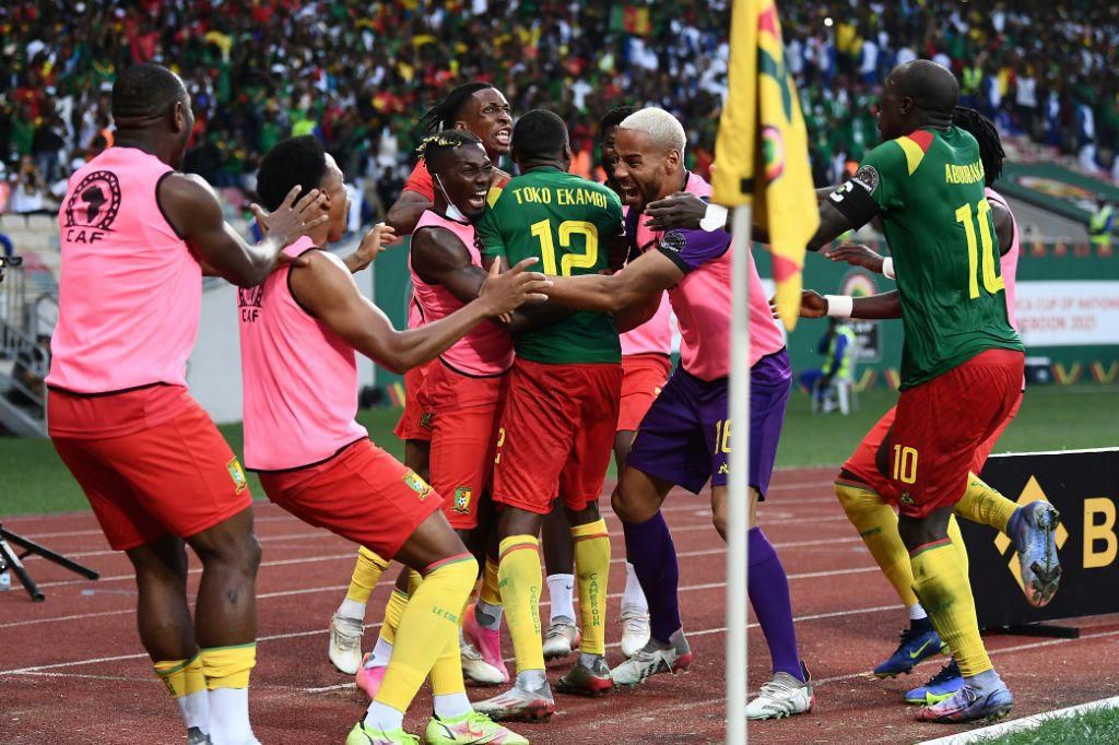 Cameroon players celebrate after Karl Toko-Ekambi scored his and his team's second goal against Gambia