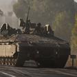 Israeli army armoured vehicles rolled towards the border with the Gaza Strip at an undisclosed location in southern Israel on October 15, 2023.YURI CORTEZ/AFP via Getty Images