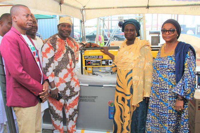 Mr Dapo Olakulehin, General Manager, Lagos State Coconut Development Authority (LASCODA), Dr Oluwarotimi Fashola, Special Adviser to the Governor on Agriculture (Rice Mill Initiative), Mrs Shakirat Dauda, beneficiary of deep freezer and generator and M...