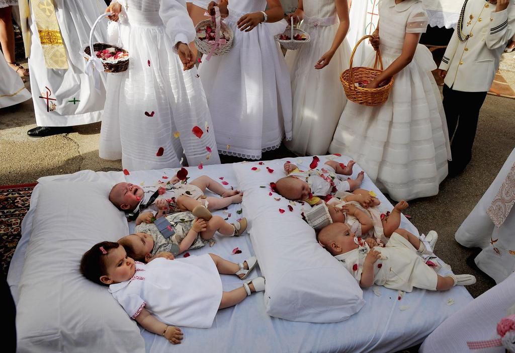 The babies dressed in white [NatGeo]