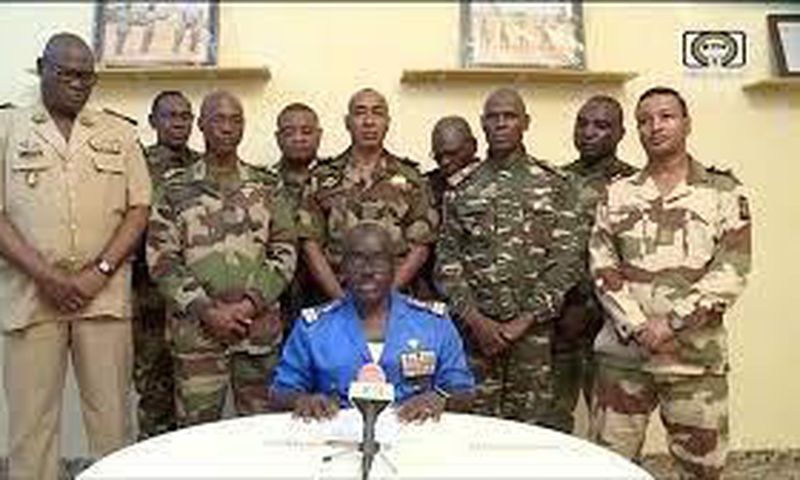 Niger Army spokesman Col. Major Amadou Adramane speaks during an appearance on national television after President Mohamed Bazoum was held in the presidential palace, in Niamey, Niger, July 26, 2023, in this still image taken from video. (ORTN/via Reut...