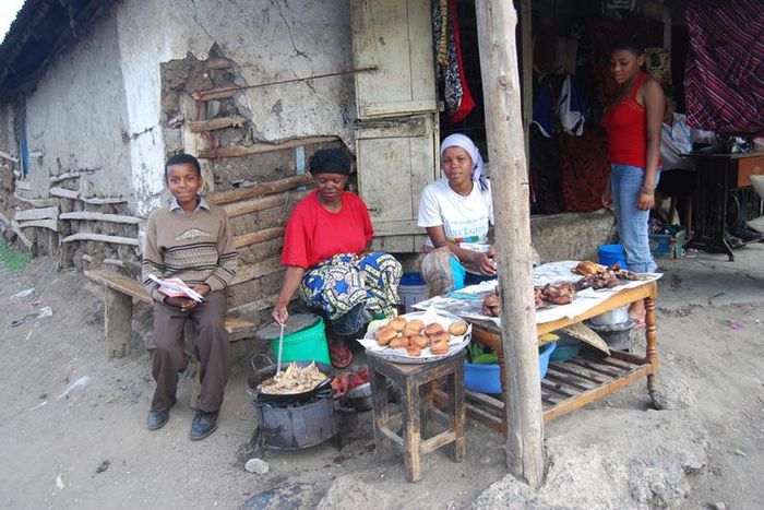 Tanazania n woman cooking and selling bereal