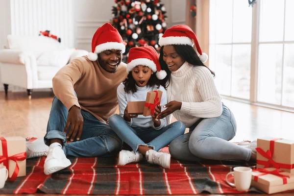 A Black family during Christmas [Shutterstock]