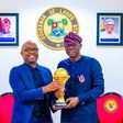 L-R: Vice-President & Head, VISA West Africa, Mr Andrew Uaboi presenting the Africa Cup of Nations (AFCON) Trophy to Gov. Babajide Sanwo-Olu of Lagos State, during an official presentation ceremony by VISA (Title Sponsor of AFCON), at the Lagos House, ...