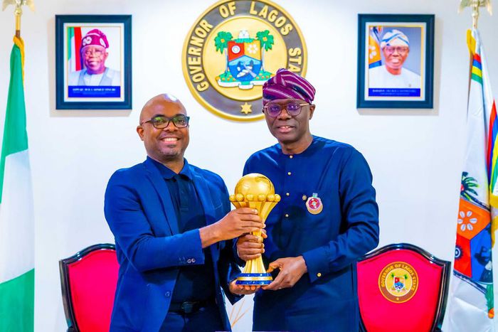 L-R: Vice-President & Head, VISA West Africa, Mr Andrew Uaboi presenting the Africa Cup of Nations (AFCON) Trophy to Gov. Babajide Sanwo-Olu of Lagos State, during an official presentation ceremony by VISA (Title Sponsor of AFCON), at the Lagos House, ...