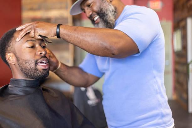 A man getting a haircut in a barbershop