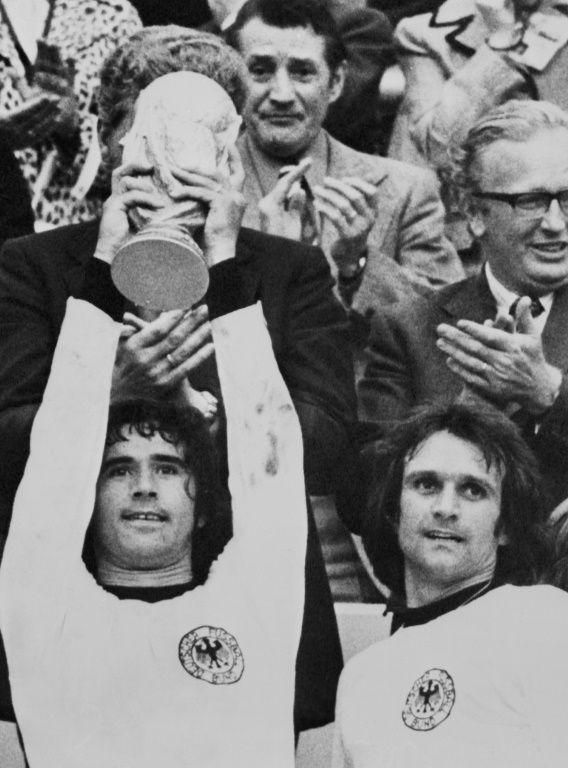 Gerd Mueller lifts the World Cup trophy after West Germany beat the Netherlands in the 1974 final in Munich.