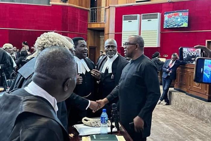Peter Obi saying hello to his legal team