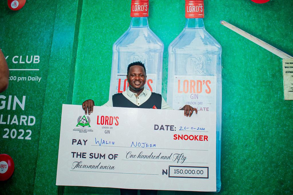 A winner at the championship with his prize money.